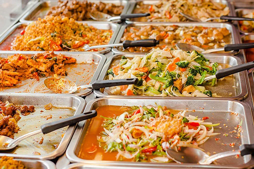 A selection of local dishes displayed in serving trays