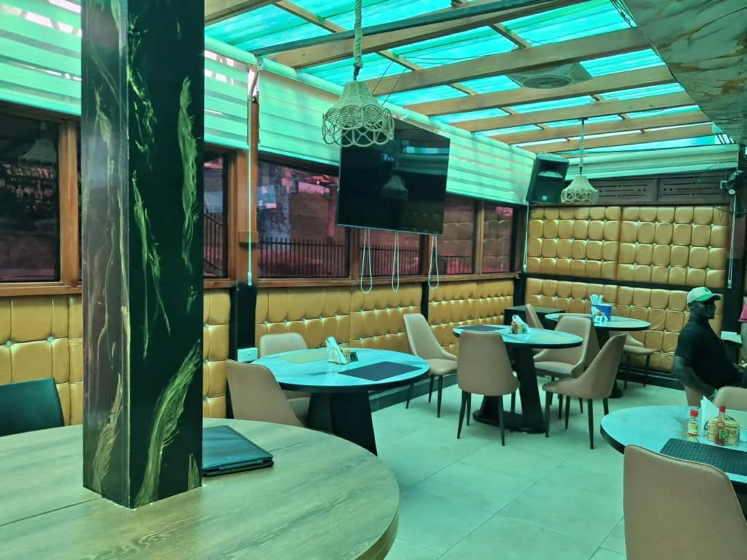 The restaurant dining area with its gold upholstered seating